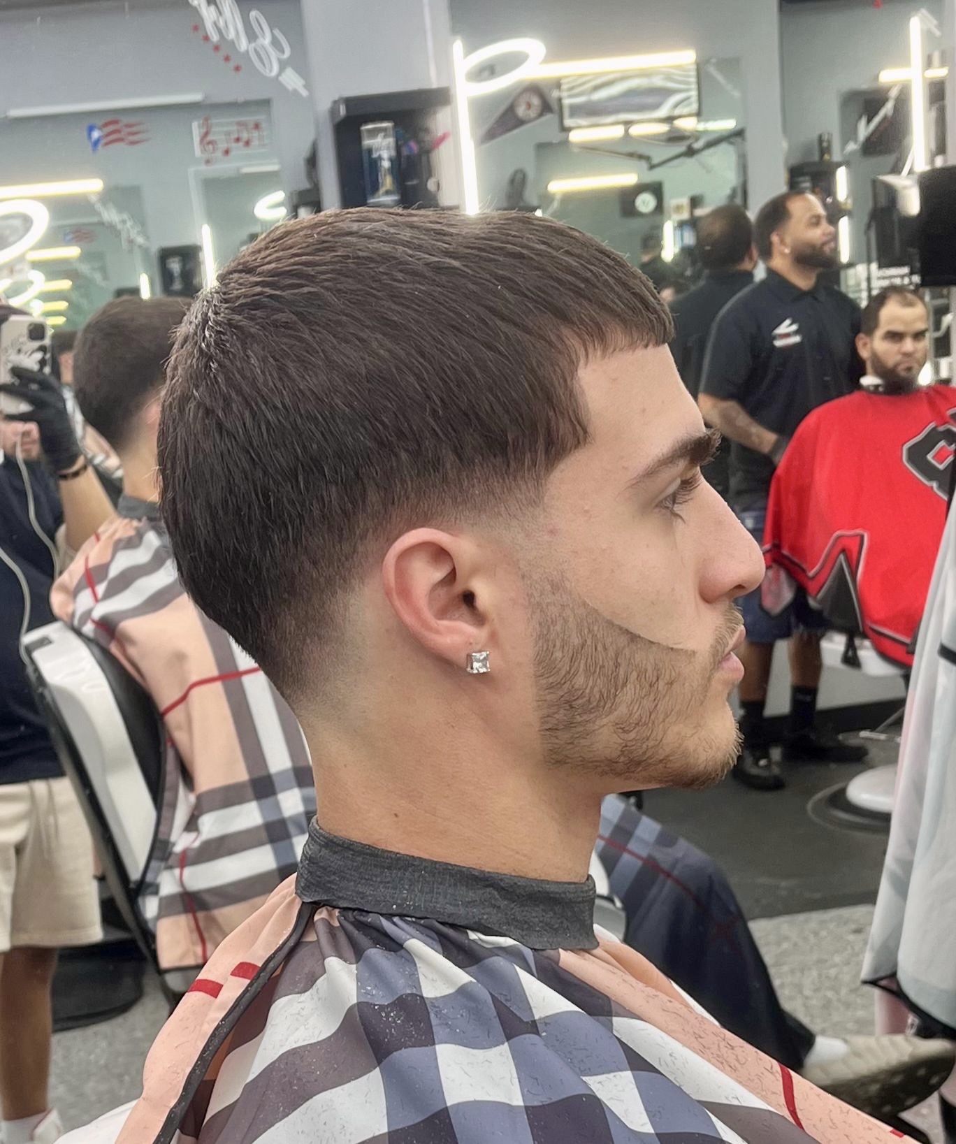 Men’s haircut with modern fade style at barbershop in Gainesville