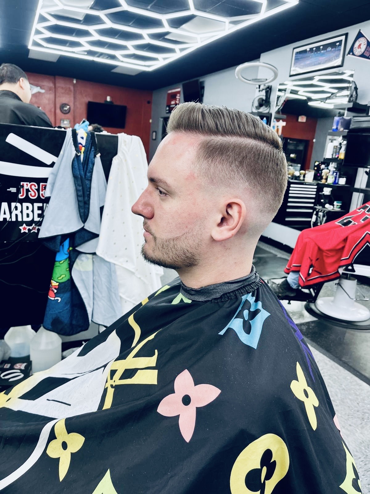 Professional beard trim and shaping service at men’s grooming barbershop